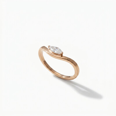 Solitaire or rose diamant navette en vague