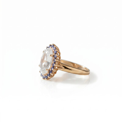 Bague or rose, aigue marine et entourage saphirs