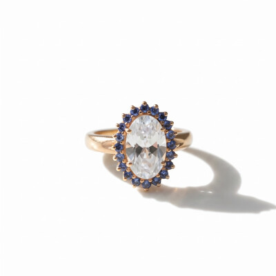 Bague or rose, aigue marine et entourage saphirs