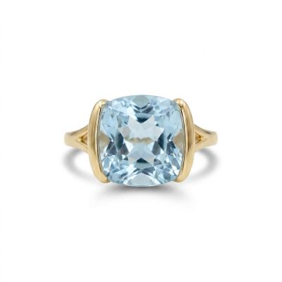 Bague or jaune et topaze bleue