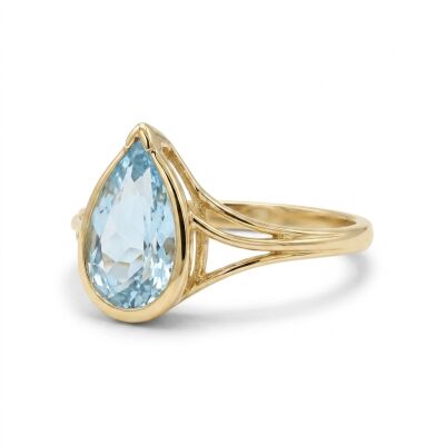 Bague or jaune et topaze bleue