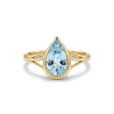 Bague or jaune et topaze bleue