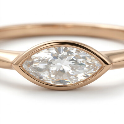 Solitaire or rose et diamants navette serti clos