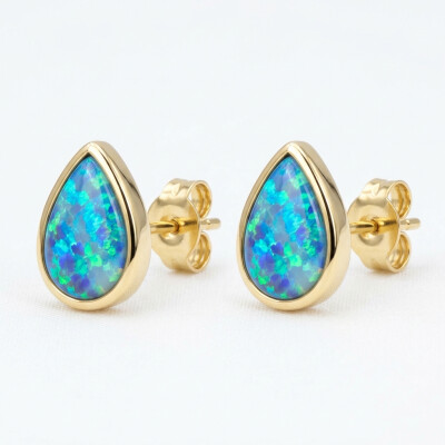Boucles d'oreilles or jaune opales doublet poire serti clos