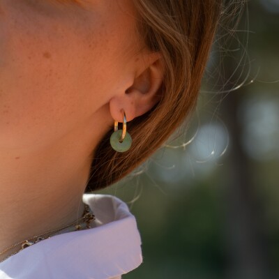 les boucles d'oreilles vert Olym