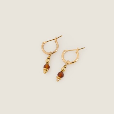 Les boucles d'oreilles Inari brunes