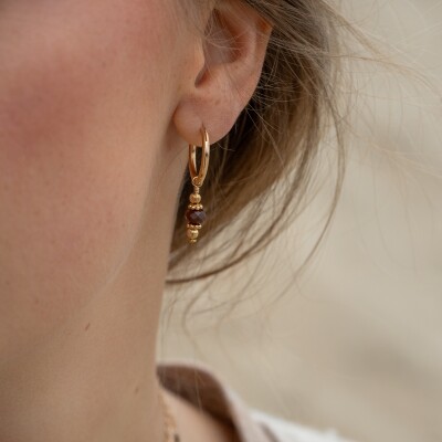Les boucles d'oreilles Celeste brunes