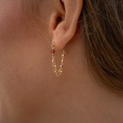 Les boucles d'oreilles Nakao brunes