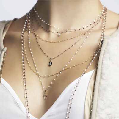 Pendentif Gigi Clozeau Croix en or rose et diamants