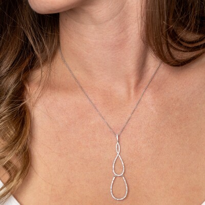 Pendentif or blanc articulé 3 gouttes entrelacées serties de diamants sur chaine en or blanc