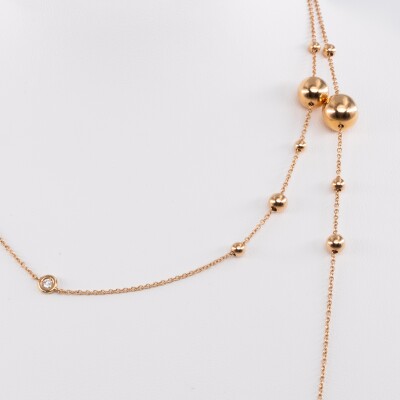 Sautoir en or rose serti de diamants et boucle d'or rose de différentes tailles