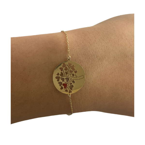 Bracelet en or avec motif arbre de vie.