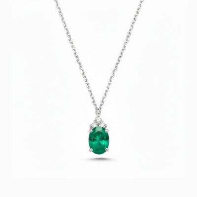 Collier or blanc, émeraude et diamant