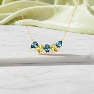 Collier or jaune 18 cts, diamant, topaze et péridot