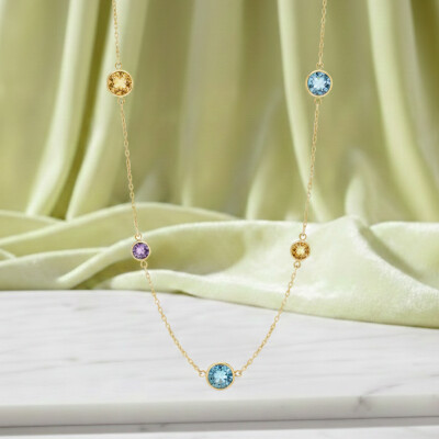 Collier or jaune et pierres fines