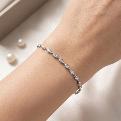 Bracelet rivière or blanc 18 cts et diamants serti clos