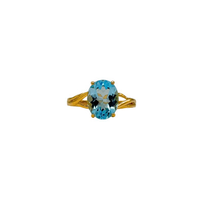 Bague Corps croisé en or jaune et Topaze bleue ovale